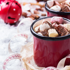 Hot chocolate with marshmallows and spices on christmas table