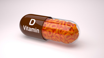 Red pill or capsule filled with vitamin D.