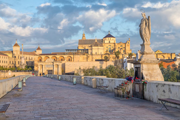 Sculprure staying on Roman bridge of Cordoba