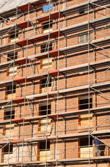 scaffolding at historic brick wall building currently under redevelopment 