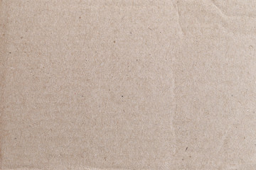 Texture of the brown paper box or cardboard.
