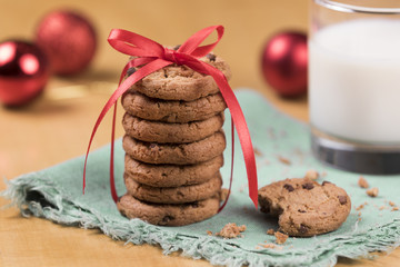 Cookies and Milk for Santa / Cookies and milk with Christmas decoration on a wooden background