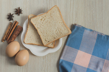 Homemade bread backfast on wood table background in morning.Tone.Selective focus.