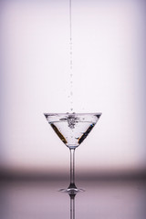 Filling a glass with water with space for text