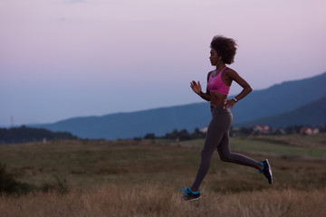 Young African american woman jogging in nature