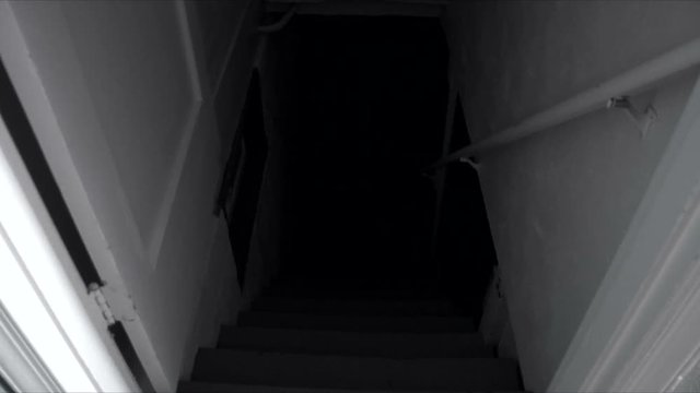 Creepy, possessed man in the basement attacks camera.