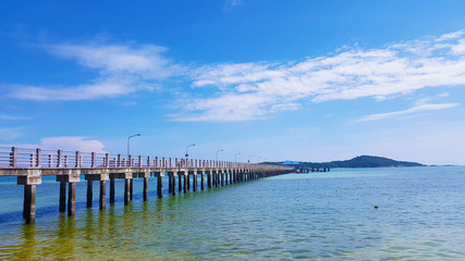 Fototapeta na wymiar Concrete Walk Bridge Across The Sea Rawai Beach Thailand