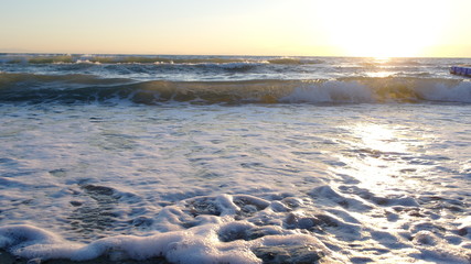 The sun rises from the waves