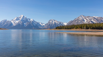 Beautiful snow-capped mountains reflected in the lake. Grand Teton National Park, Wyoming, USA