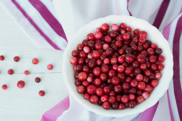 Red cranberry and white dish on pink napkin