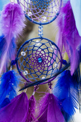 Obraz premium Dreamcatcher made of feathers, leather, beads, and ropes
