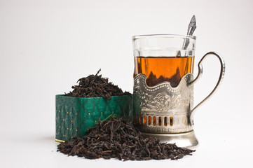 dry tea leaves  and glass
