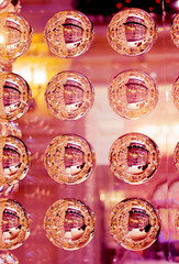 Colorful lights on red background. Red and orange holiday bokeh. Abstract Christmas background