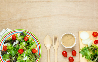 Top view cooking salad with sauce on wood table with copy space.