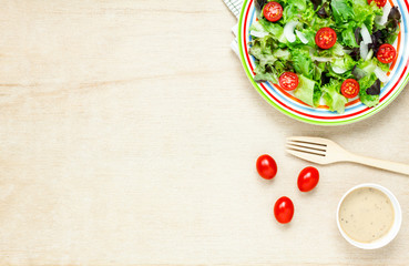 Top view cooking salad with sauce on wood table with copy space.