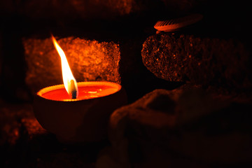 candle light on brick wall.
