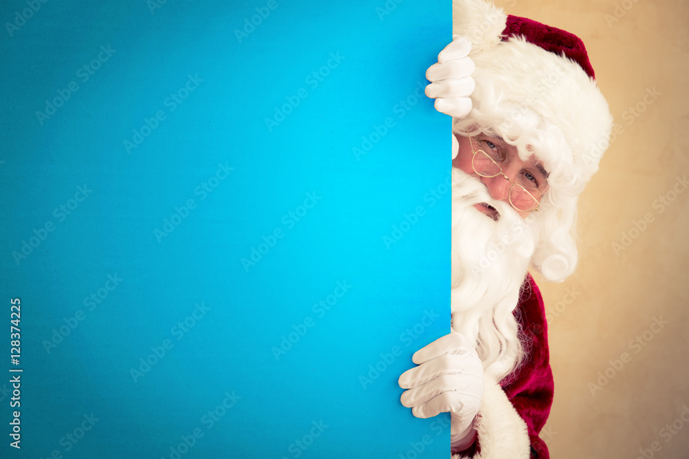 Wall mural santa claus holding banner