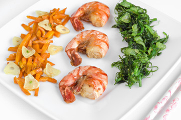 Seafood and vegetables on a white background. High key, selective focus.