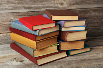 Old antique books on grey wooden table