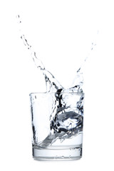 Glass of water with ice cube isolated on a white