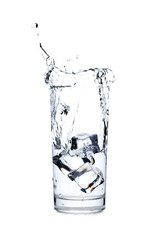 Glass of water with ice cube isolated on a white