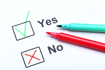 Check boxes yes and no on white paper
