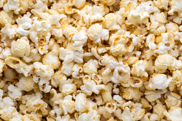 Popcorn background. Caramel sweet corn. Cinema snack.