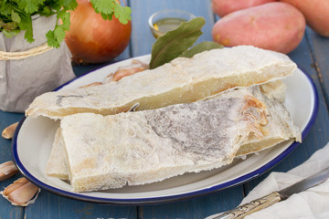 salted dry fish with potato and onion