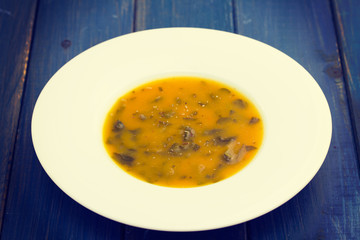 vegetable cream soup on white plate