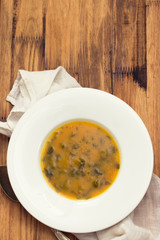 vegetable cream soup on white plate