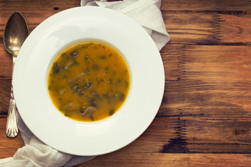 vegetable cream soup on white plate