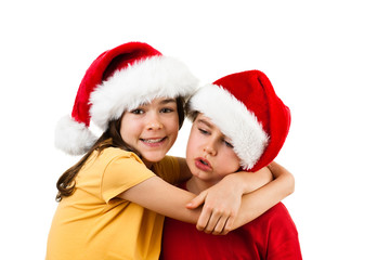 Christmas time - girl and boy with Santa Claus Hat