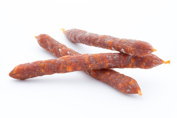 Smoked sausage salami isolated on a white background.