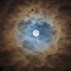 Naklejka na ściany i meble Moon surrounded by clouds with surreal lighting