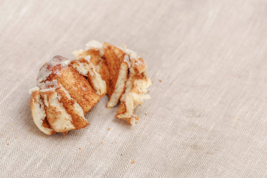 Freshly cinnabon French bun with cinnamon and cream, selective focus