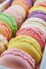 Colorful french macaroons in a box