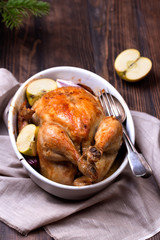 roasted chicken on wooden table, top view