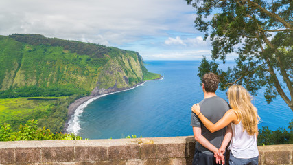 Young couple enjoying the amazing view in Waipio Valley, Big Island, Hawaii, Usa