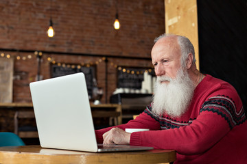 old man with a laptop
