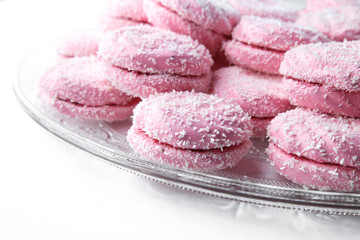 marshmallow - zephyr with coconut flakes on a white background.