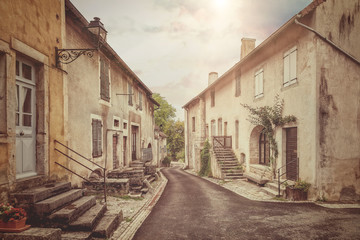 Fototapeta na wymiar Old street in France. Vintage style photo