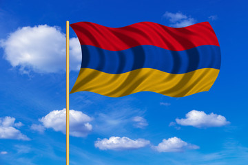 Flag of Armenia waving on blue sky background