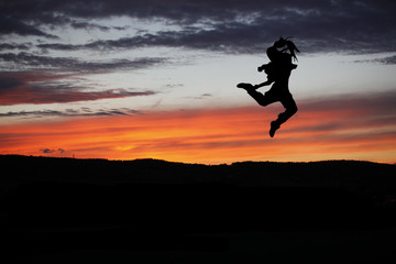 Ballet dancer posing during the sunset