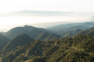 Obraz premium View of morning mist and hills at Doi Ang Khang mountain one of the famous mountains in Chiangmai,Thailand
