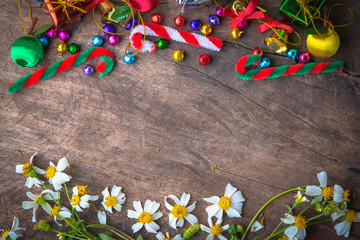 Fototapeta premium Christmas and new year wooden background banner with with gift box, daisy flower candy balls.decoration on vintage background.