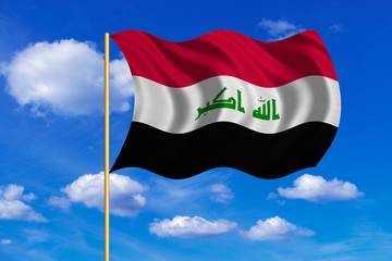Flag of Iraq waving on blue sky background