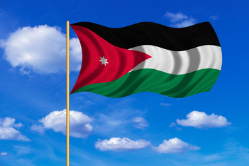 Flag of Jordan waving on blue sky background