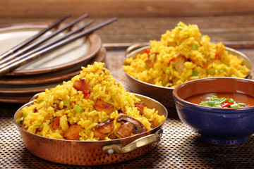 Chicken with basmati rice fried in stainless pan