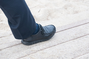 closeup view of man's leather black shoes,Businessman walking to the office