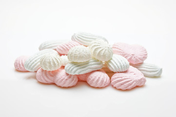 pink and white meringue cake on white background